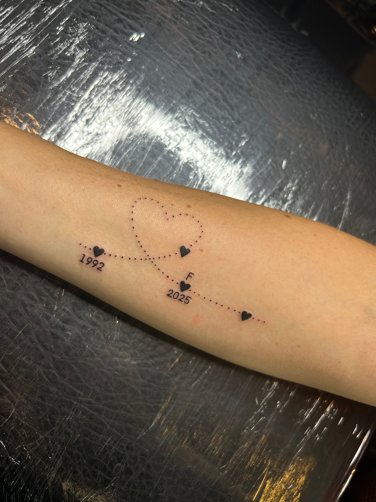 Sterrenbeeld met datums tattoo